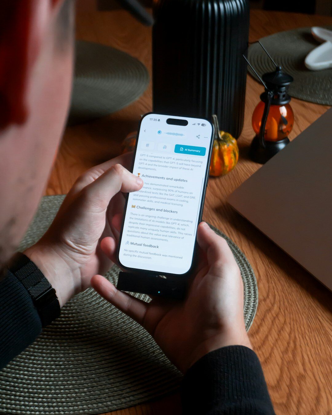 Woman reading celebrity news on a smartphone at home