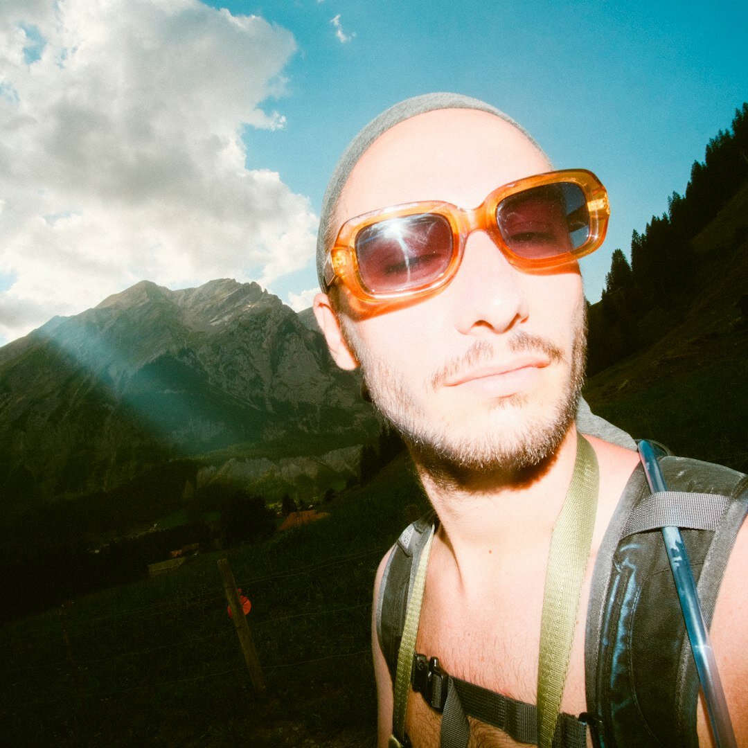Portrait of a Swiss male photojournalist with glasses