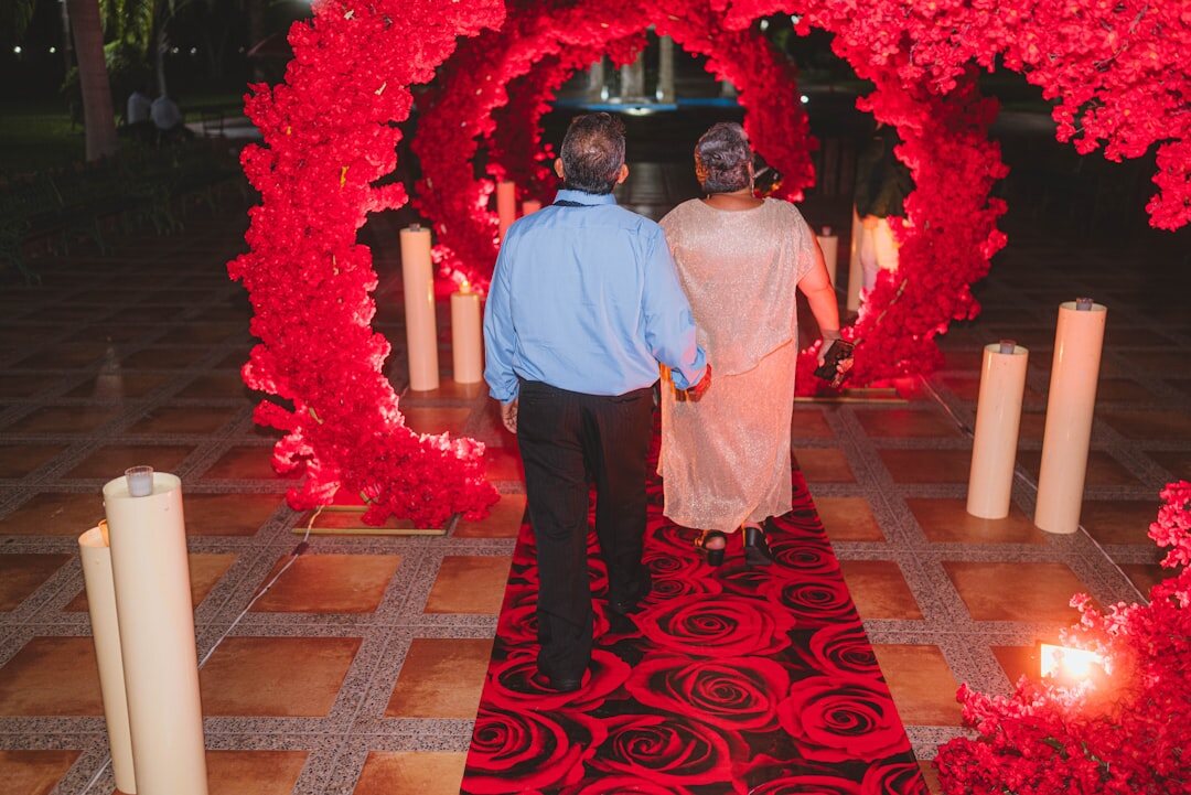 Red carpet event with photographers and camera flashes